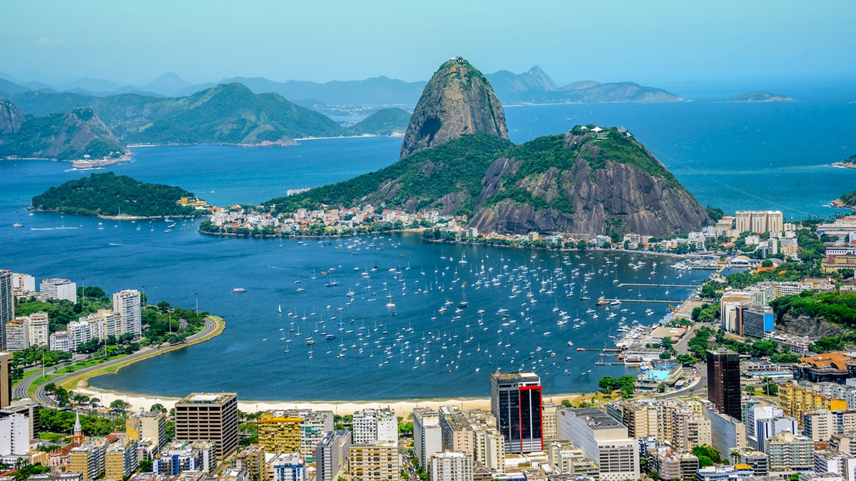 View from the bird's eye view on the Sugarloaf mountain, Botafogo bay with white sailing yachts and city landscape, Rio de Janeiro, Brazil